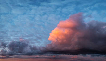 Abstract natural background, sky and puffy clouds, pink sunset