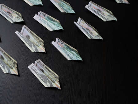 Paper planes made of dollar bills, usd cash flow concept. Inflation and problems in the economy,...