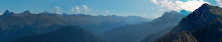 Beautiful mountain landscape. High-mountain massif, clouds over mountain peaks. panorama in high...