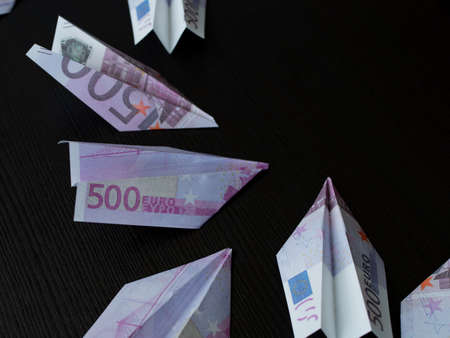Paper airplanes made of Euro banknotes, the concept of cash flow. Investments in promising sectors of the economy, speculation in the foreign exchange marketの写真素材