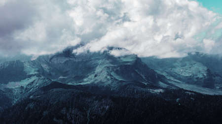 Beautiful mountain landscape. High-mountain massif, clouds over mountain peaks. Harsh mountain peaks in the clouds, the power of natureの写真素材
