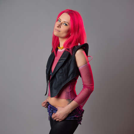 Futuristic fashion, a young bright and attractive woman with pink hair,の写真素材