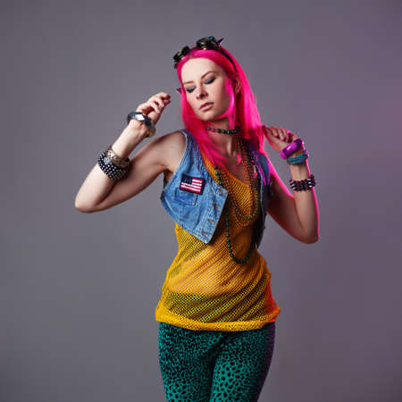 Futuristic fashion, a young bright and attractive woman with pink hair,