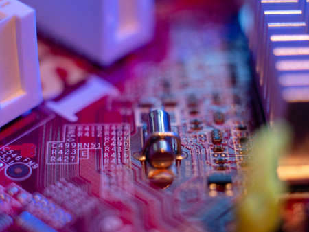 Computer motherboard, microchips close-up in color illumination,の写真素材