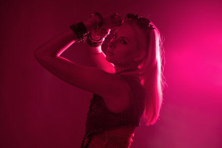 Disco style, young attractive woman in retro style outfit dancingの写真素材