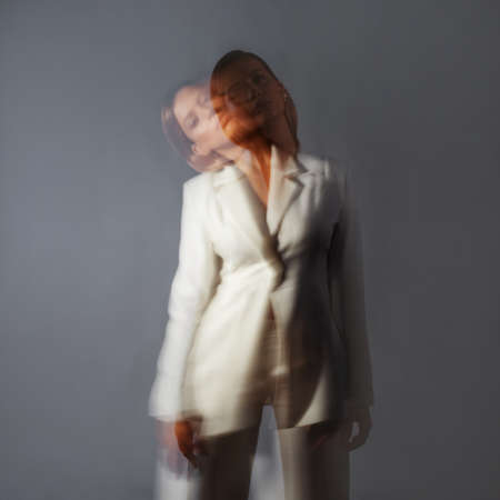 Fashion portrait with the effect of blurring in motion at a long shutter speed,の写真素材