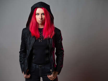 Stylish and bold, young woman in youth-style clothing,の写真素材