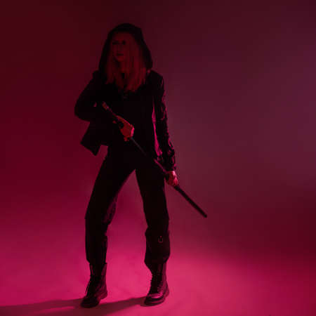 Techno cyber punk style, futuristic ninja, young woman with pink hair