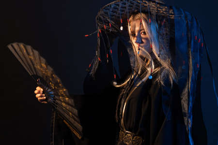 An Asian-style character in a kimono and a straw hat with ribbons
