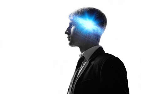 Dreamer, creative mind concept. A man with a galaxy in his head,の写真素材