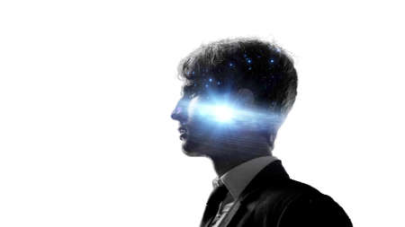 Creativity and intelligence, concept. A man and space with a galaxyの写真素材