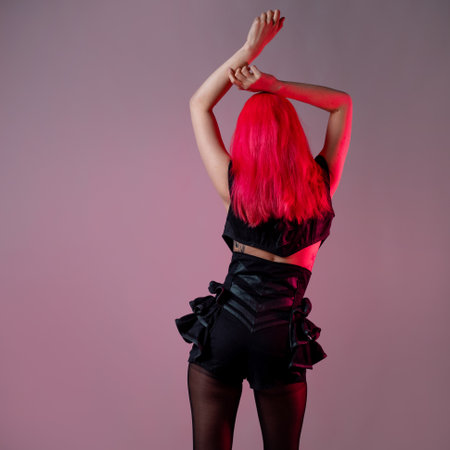 Goth sexy look. young attractive woman with pink hairの写真素材