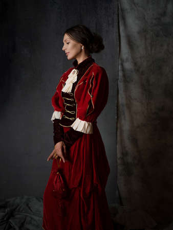 A lady in a purple medieval dress, a portrait in the style of ancient paintings,の写真素材