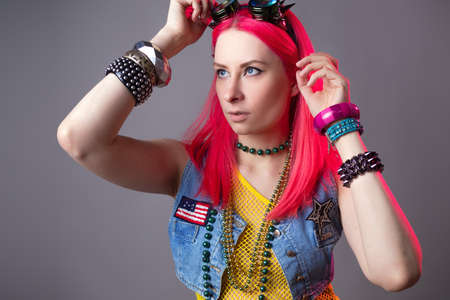 Futuristic fashion, a young bright and attractive woman with pink hair,の写真素材