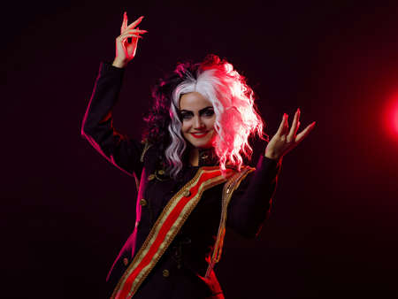 A bright and shocking woman with a black and white hairstyle