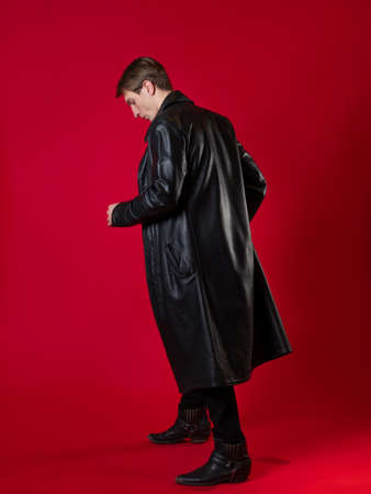 A young charismatic man in black clothes, the hero of a noir story,の写真素材