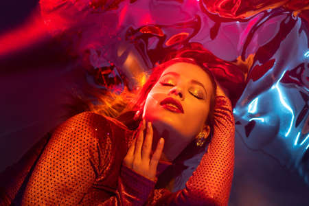Portrait of a young beautiful woman on a shimmering background, iridescent colored light, futuristic...