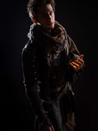 A guy in a steampunk or post-apocalyptic image, portrait on a black backgroundの写真素材