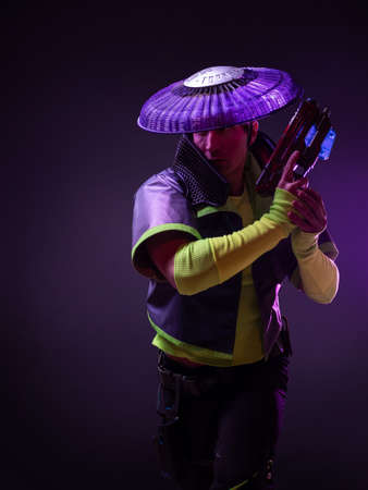 Futuristic character in a bright stylized outfit, photo with neon colors. A fantastic character, a...