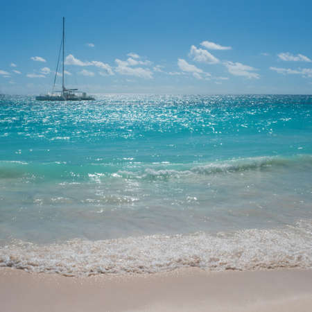 Beautiful sea, Caribbean Sea.tropical island, sailing yacht on the horizonの写真素材