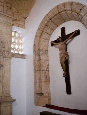 Crucifixion with Jesus Christ, cross and sculpture in a Catholic church. The symbol of faith, the Savior on the crossの写真素材