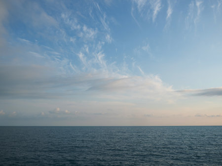 Sea sky and horizon, beautiful calm landscape. the sea before sunset, transparent clouds in the skyの写真素材
