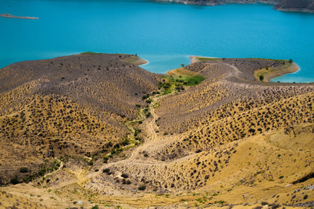 Landscape of arid quarry and deep blue lake,coastlineの写真素材