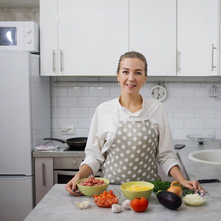 Eggplant baked with minced meat and cheese, the cooking processの写真素材