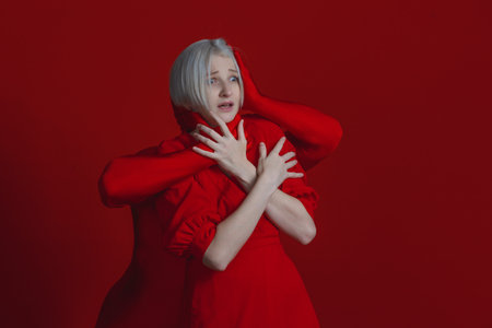 The struggle of an individual with their complexes and fears, and with external pressures. The conflict between public opinion and personal attitudes, a struggle within an individual, a concept.の写真素材