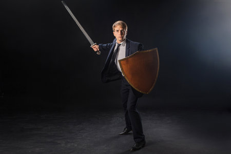 Antivirus, a digital defender of your business, a concept. A young man in a business suit with a tie...