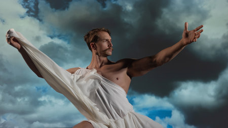 A muscular, athletic figure embodying Zeus, the ancient Greek god of thunder, stands powerfully with a toga draped over his shoulders.の写真素材