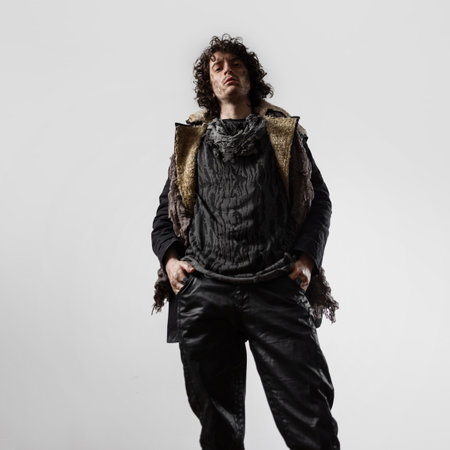 A dramatic hero from the post-apocalypse, a young man in mud and dirty clothes, a daring survivalistの写真素材