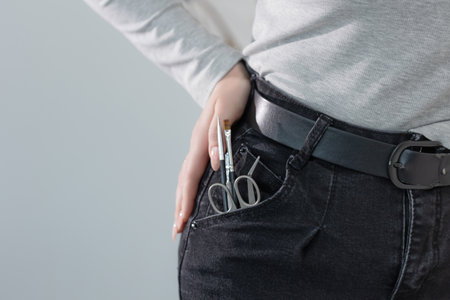 Manicure tools casually arranged in a jeans pocket, a trendy concept for beauty professionalsの写真素材