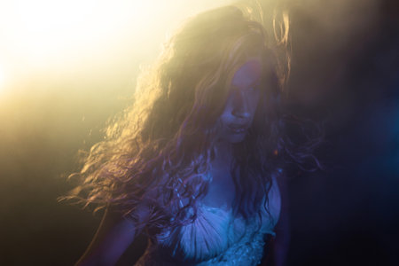 Ethereal female portrait, flowing locks in dramatic wind, bathed in mystical colored lighting...