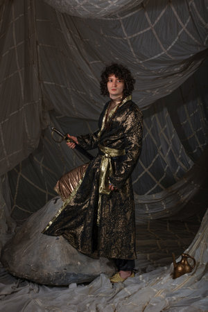 Dashing man in hybrid formalwear - western suit base with Arabian decorative elements