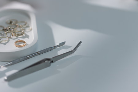 Manicure tools arranged on light background, clean elegant close-up for beauty salon content.