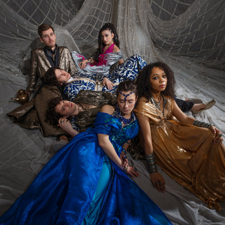 A group portrait in the style of oriental fairy tales, young men and women in oriental costumes. Arabic or Turkish style, costume photographyの写真素材