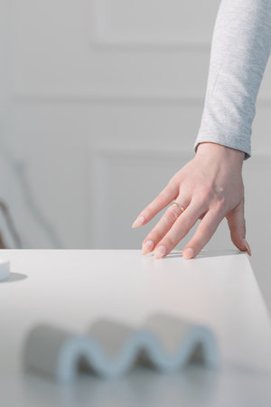 Elegant long almond nails with beige gel polish, close-up of stylish feminine handsの写真素材