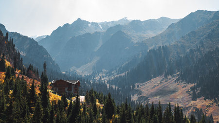 A house in the mountains, a landscape with a secluded house on the mountainside, a vacation in a...