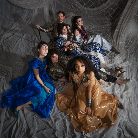 A group portrait in the style of oriental fairy tales, young men and women in oriental costumes....