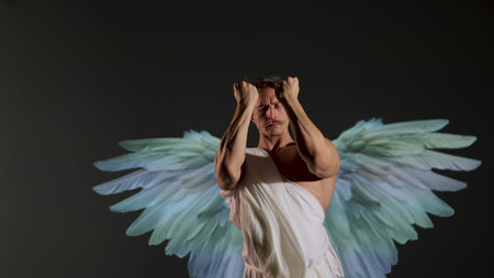 Renaissance-style warrior angel concept: powerful male figure in classical white robe. Muscular battle angel in white tunic, inspired by Renaissance art and classical sculpture styleの写真素材