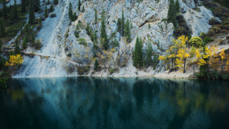 Turquoise mountain lakes surrounded by rugged peaks, breathtaking hiking destination viewsの写真素材
