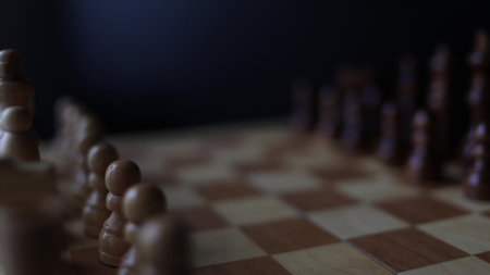 Animated sequence showing chess pieces on revolving board, capturing the essence of strategic decision-making and the black versus white dichotomy in chessの写真素材