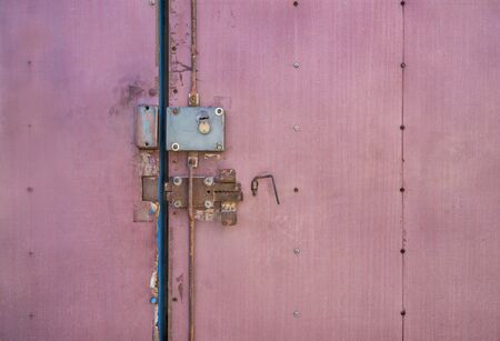 Old lock on the door. lock on the door of an old farmhouse . true village style . close-up. focus on...