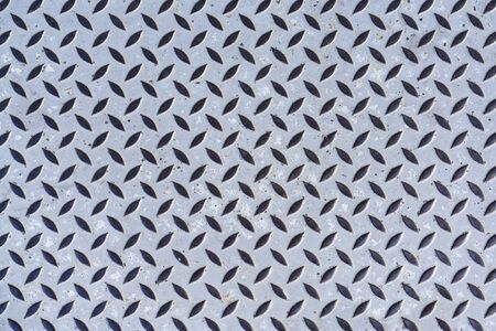 Steel gray checkerplate metal sheet texture background, old metal diamond plate in silver color...