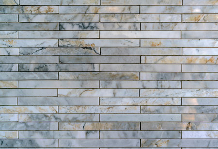 Stone cladding wall made of striped stacked slabs of natural brown rocks, panels for exteriorの写真素材