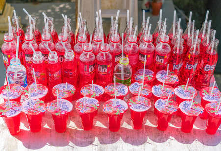 Red drinks are given to holy statue by placing it in the front of the statue as an offer.