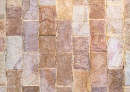 Stone cladding wall made and gender of striped stacked slabs of natural brown rocks, panels for...