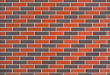 Wall of modern red black brick, background, texture with grout