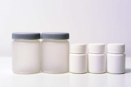 Medicine bottles for pills, blank pills container with blank label on white background.の写真素材